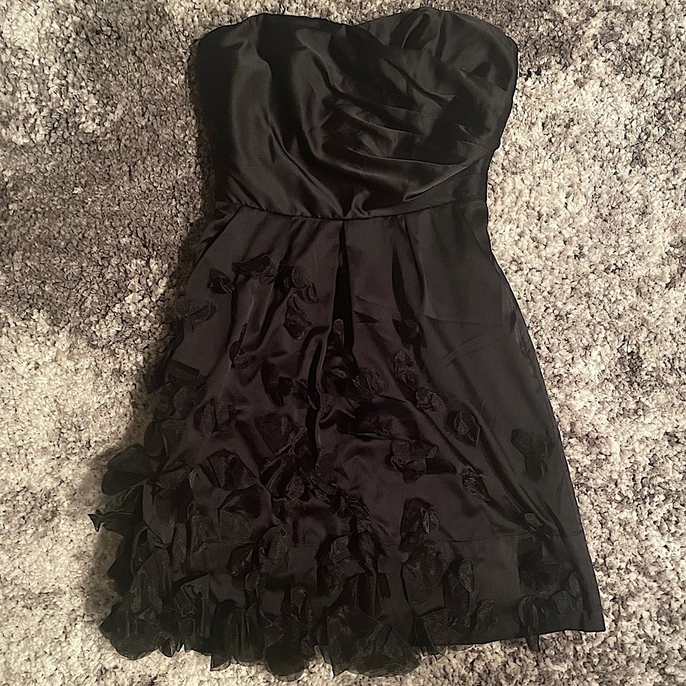 Short length, strapless, black cocktail dress with beautiful 3-D floral design.